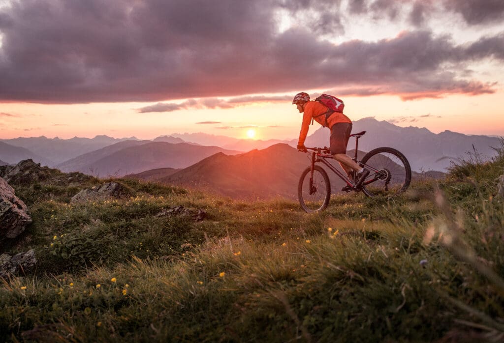 Male,mountainbiker,at,sunset,in,the,mountains